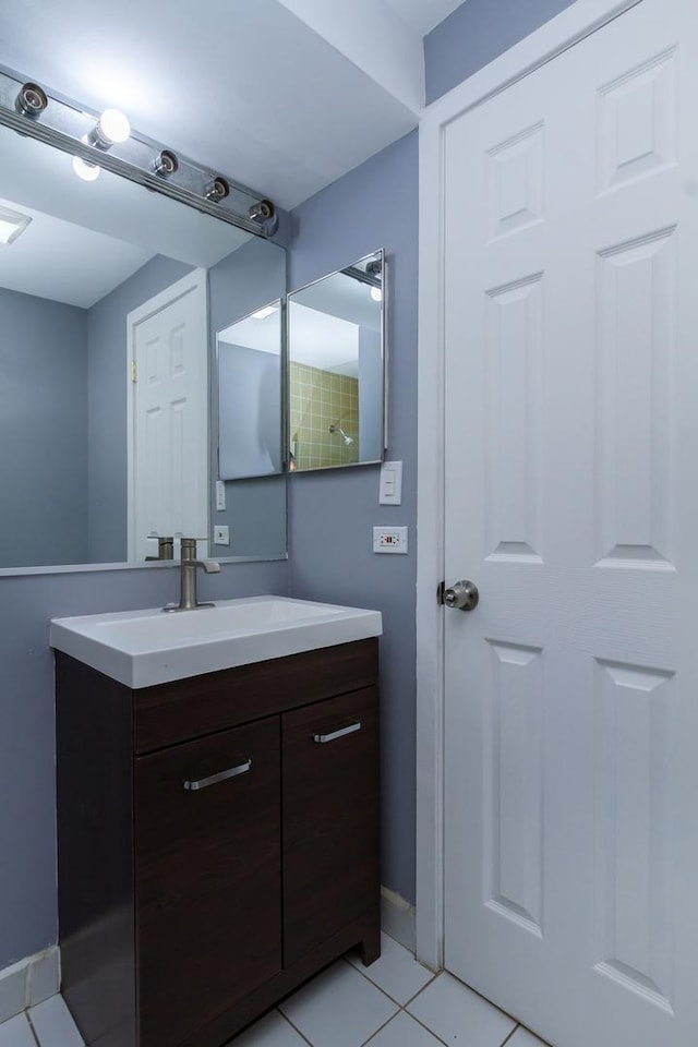 bathroom with tile patterned flooring and vanity