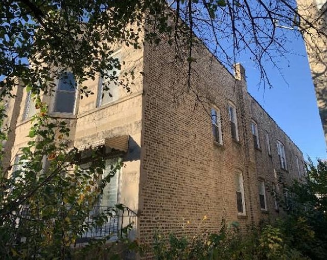 view of home's exterior featuring brick siding