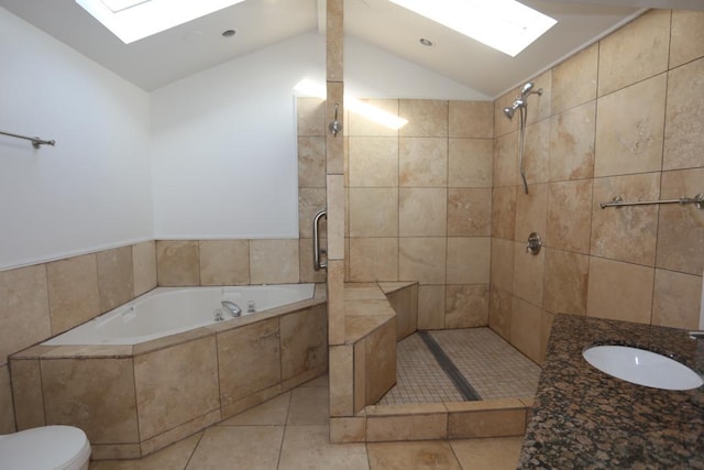 full bathroom with lofted ceiling with skylight, tile patterned floors, sink, separate shower and tub, and toilet