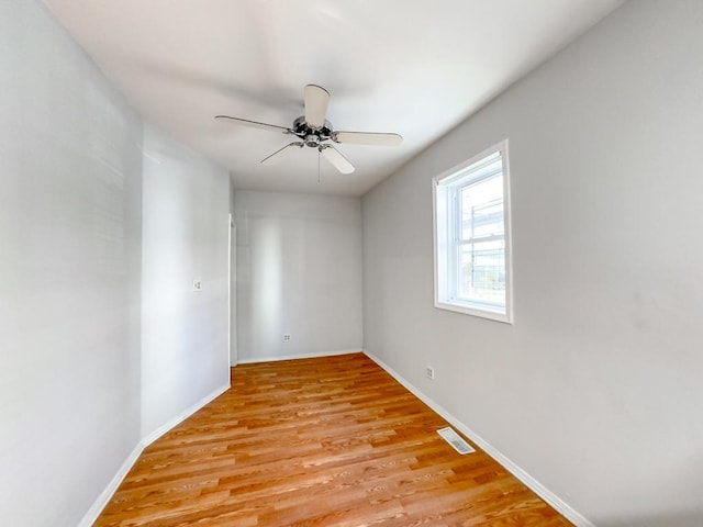 unfurnished room featuring ceiling fan and light hardwood / wood-style flooring