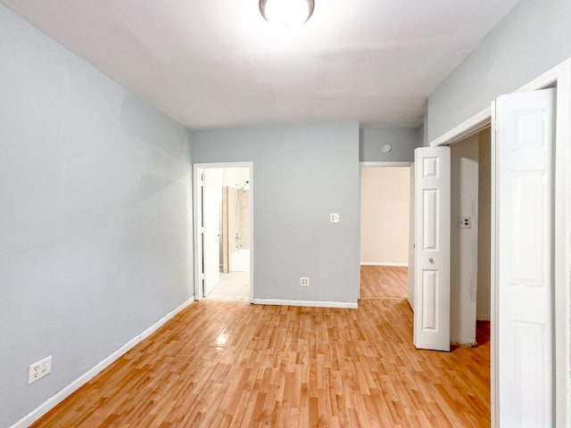 unfurnished room featuring light wood-type flooring