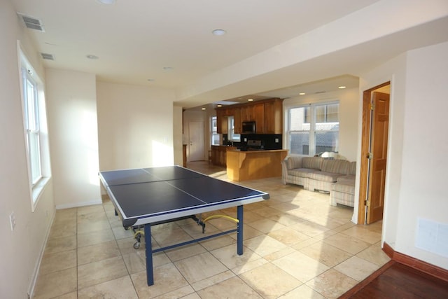 recreation room featuring light tile patterned flooring