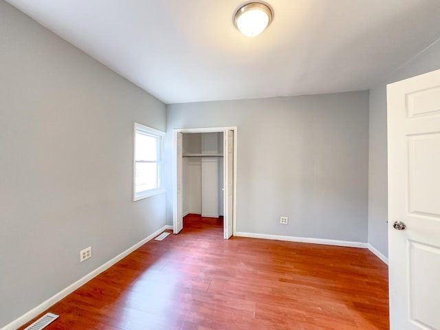 unfurnished bedroom featuring wood-type flooring