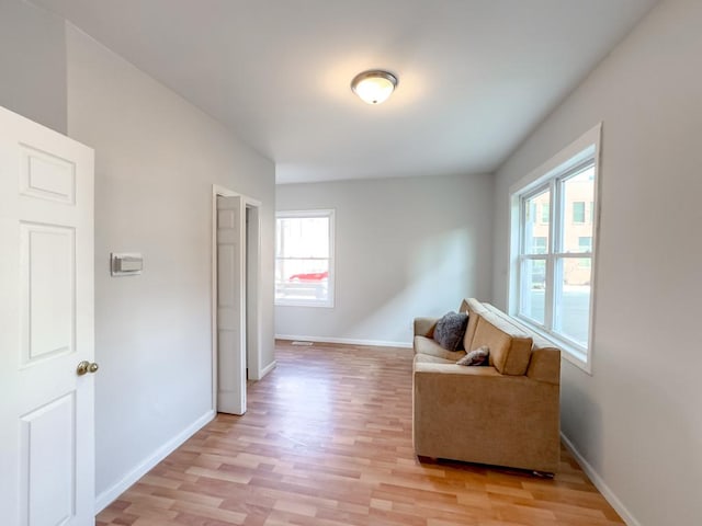 sitting room featuring light wood-type flooring