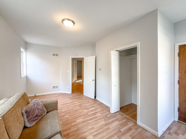 sitting room with light hardwood / wood-style flooring