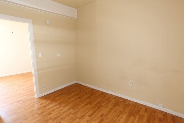 empty room featuring hardwood / wood-style floors