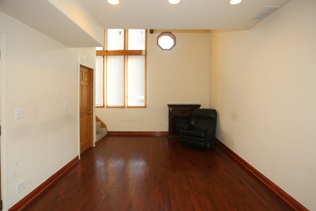 empty room with dark hardwood / wood-style floors