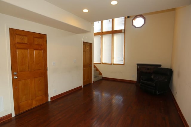 unfurnished room featuring dark wood-type flooring