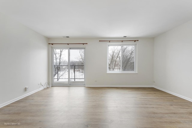 spare room with light wood-type flooring