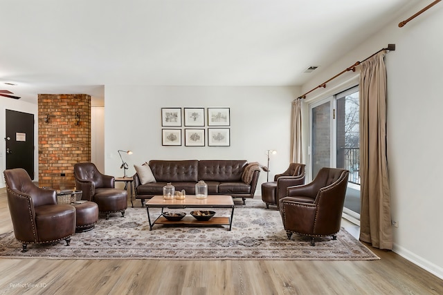 living room with light hardwood / wood-style flooring