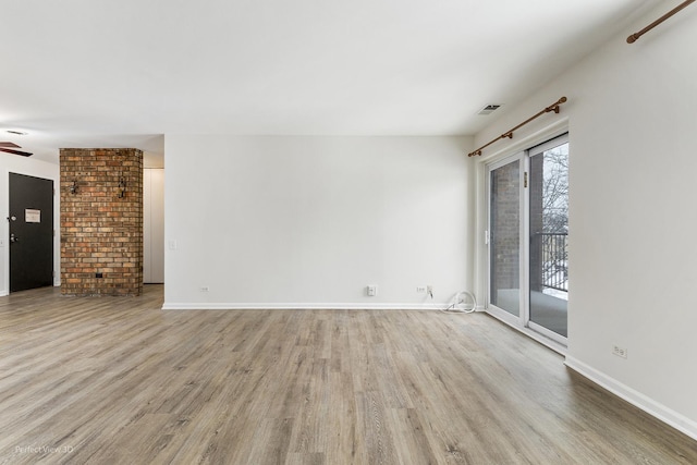 unfurnished room featuring ceiling fan and light hardwood / wood-style flooring