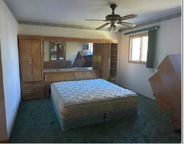 carpeted bedroom with ceiling fan