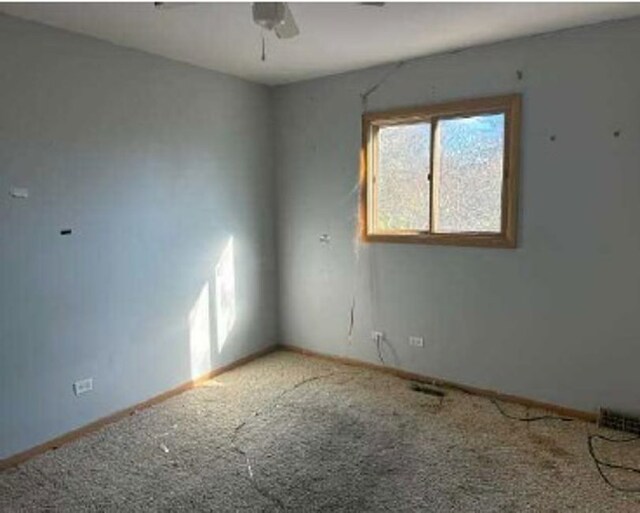 3710 Briar Ln, Hazel Crest, IL 60429 - carpeted empty room featuring a ceiling fan and baseboards