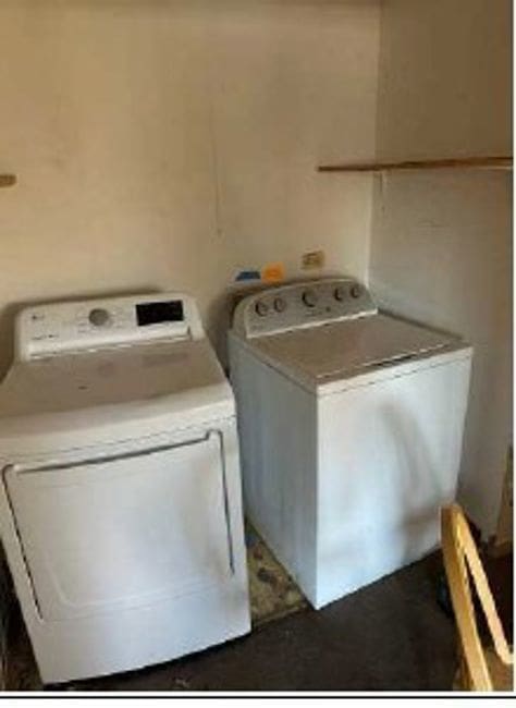 laundry area featuring washing machine and clothes dryer