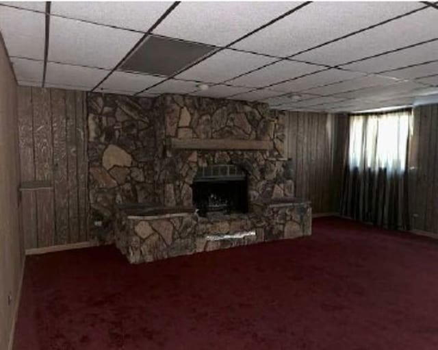 3710 Briar Ln, Hazel Crest, IL 60429 - unfurnished living room with carpet floors, wooden walls, a paneled ceiling, and a fireplace