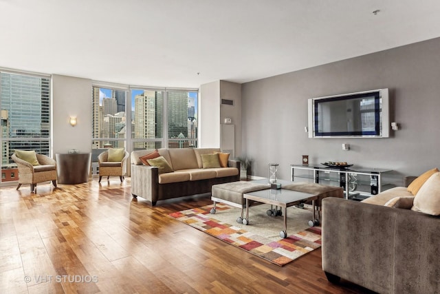 living room featuring hardwood / wood-style flooring and expansive windows