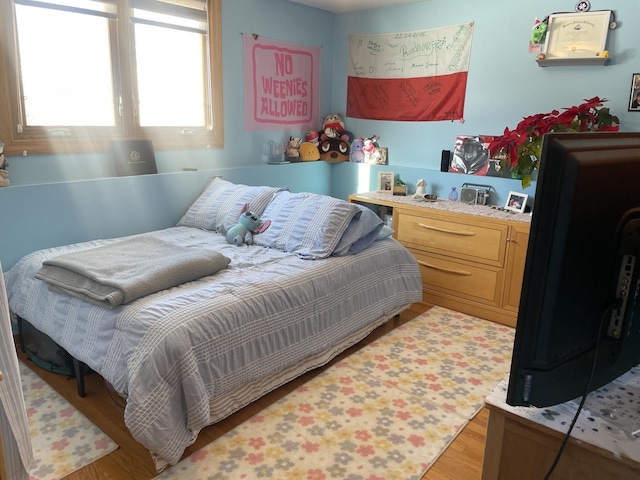 bedroom featuring light wood-type flooring