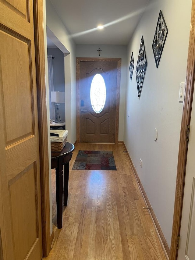 doorway with light wood-type flooring