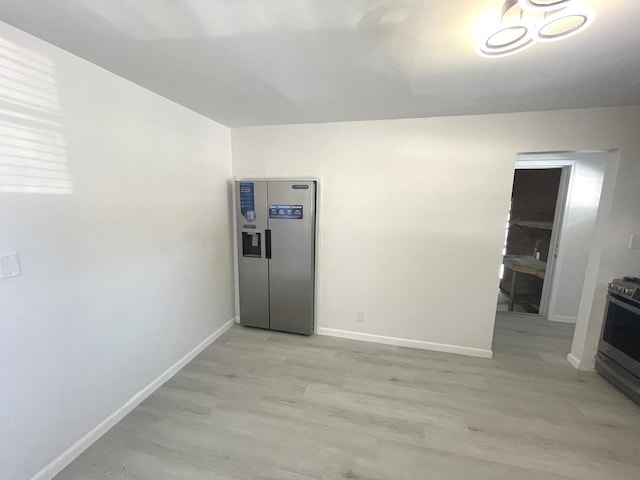 unfurnished room featuring light hardwood / wood-style floors