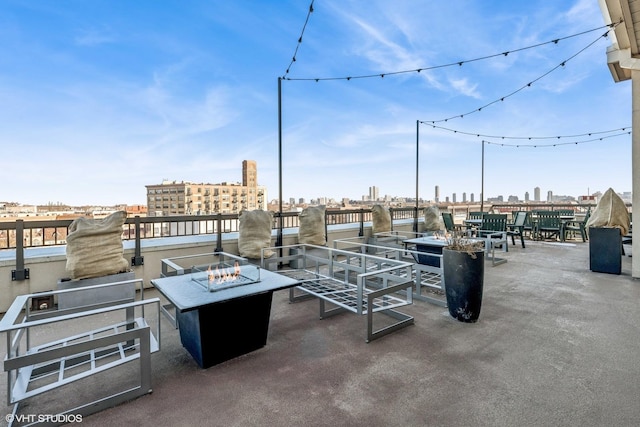 exterior space featuring a view of city and a fire pit