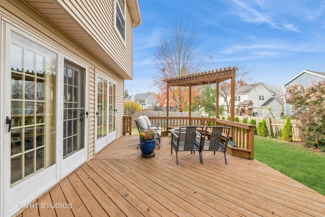 deck with a pergola, a yard, and french doors