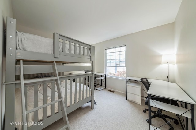 bedroom featuring light colored carpet