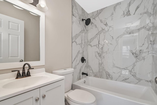 full bathroom with toilet, tiled shower / bath, and vanity