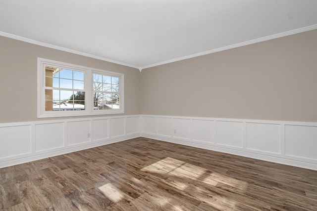 unfurnished room with dark hardwood / wood-style flooring and crown molding