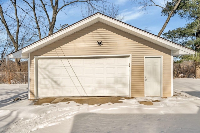 view of snow covered garage