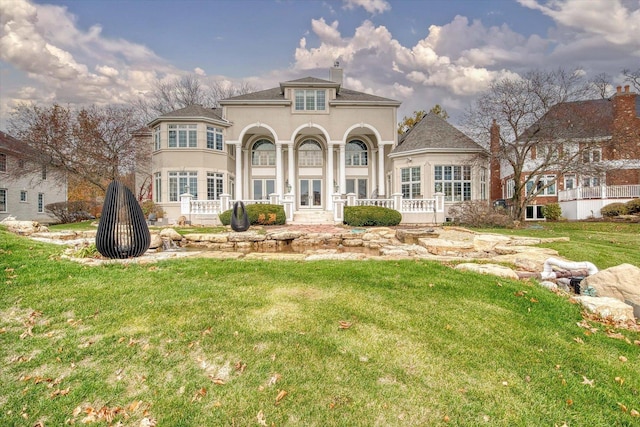 rear view of house with a lawn