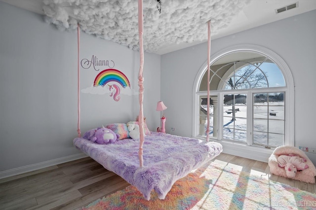 bedroom featuring wood-type flooring