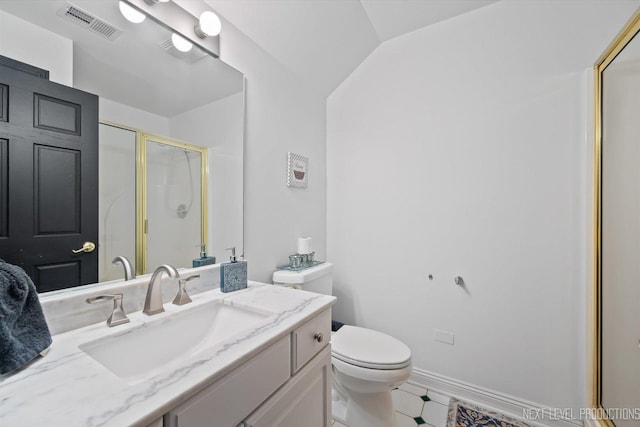 bathroom featuring walk in shower, vanity, and toilet