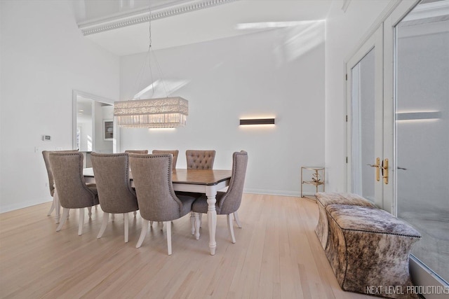 dining space with light hardwood / wood-style floors