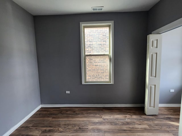 empty room featuring dark hardwood / wood-style floors