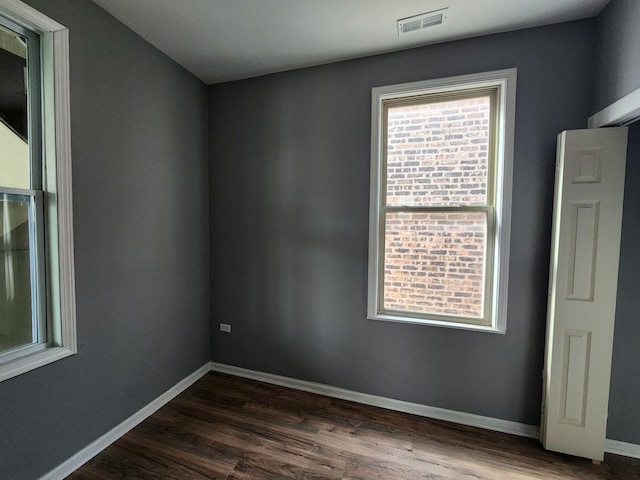 empty room featuring dark hardwood / wood-style floors