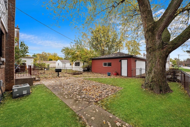 view of yard featuring a patio and an outdoor structure