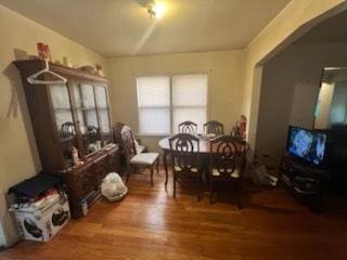 dining space with hardwood / wood-style flooring