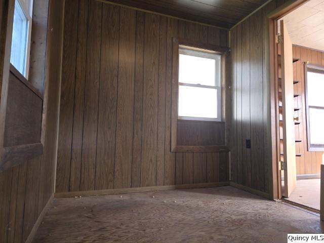 empty room with wooden walls