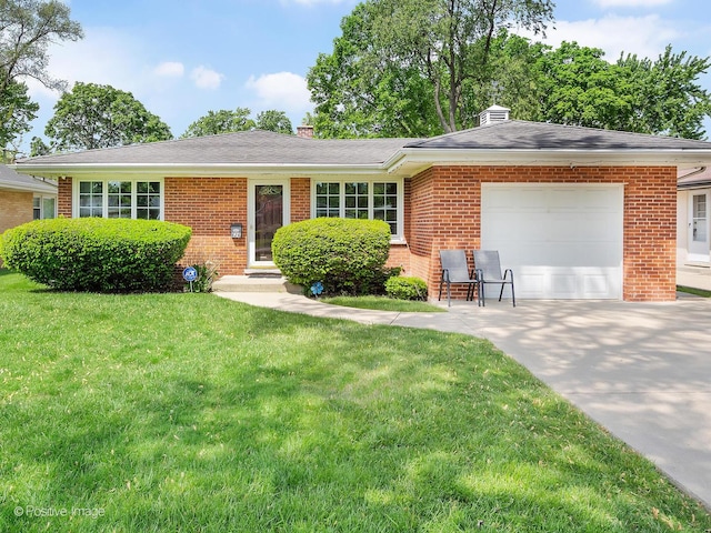 single story home featuring a garage and a front yard