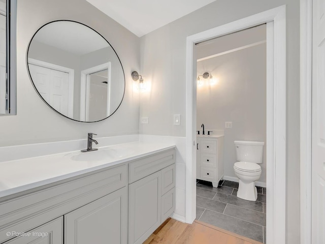 bathroom featuring vanity and toilet