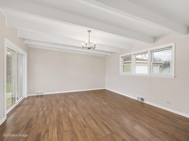 empty room featuring beam ceiling, dark hardwood / wood-style flooring, and an inviting chandelier