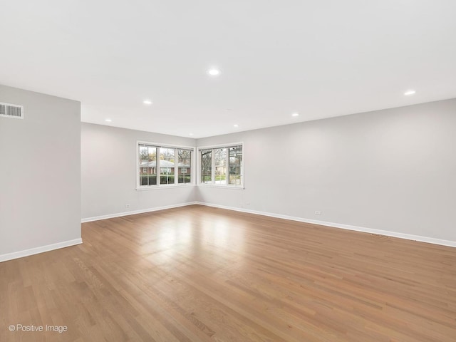 spare room featuring light hardwood / wood-style floors