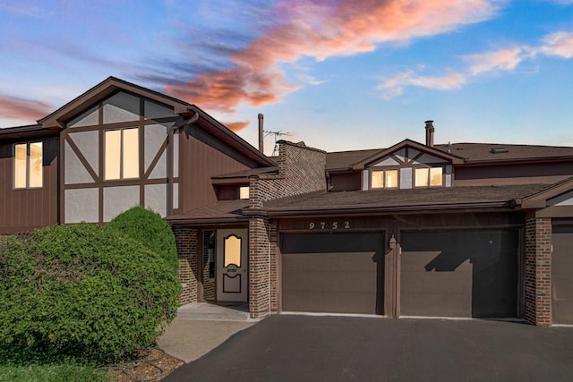 tudor home featuring a garage