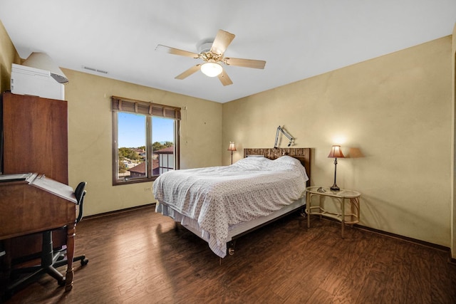 bedroom featuring ceiling fan and dark hardwood / wood-style floors