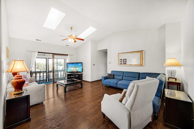 living room with lofted ceiling with skylight, ceiling fan, and dark wood-type flooring