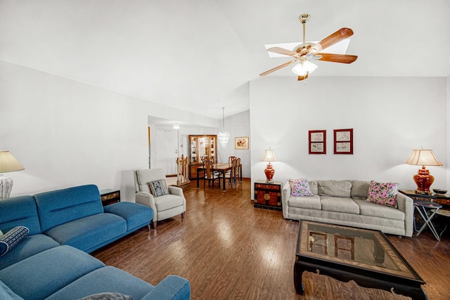 living room featuring vaulted ceiling, ceiling fan, and dark wood-type flooring