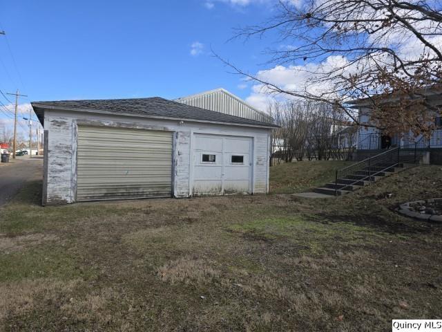 garage with a yard