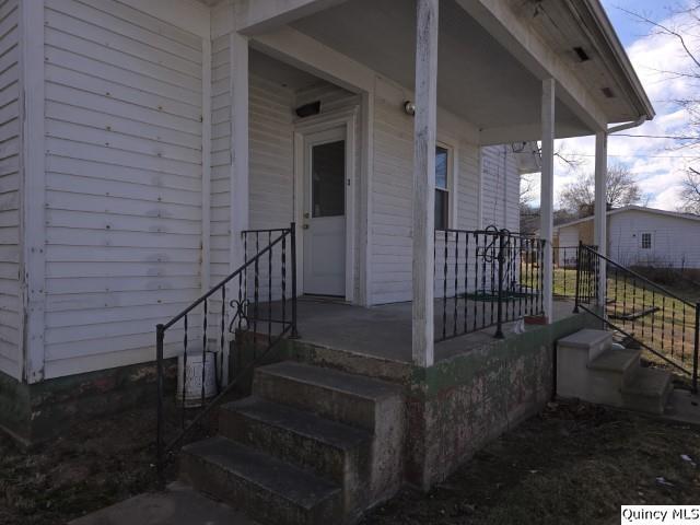 doorway to property featuring a porch