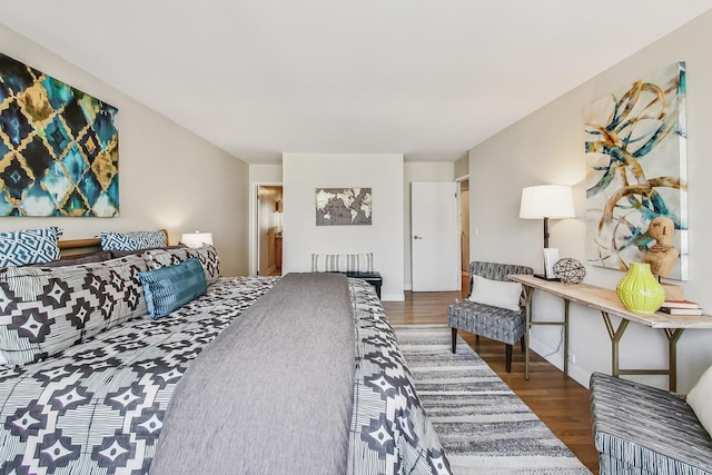 bedroom featuring dark hardwood / wood-style flooring