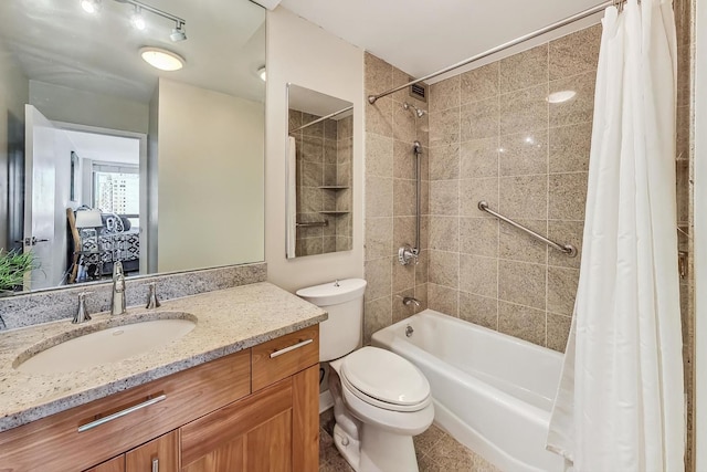 full bathroom featuring shower / bath combination with curtain, toilet, and vanity